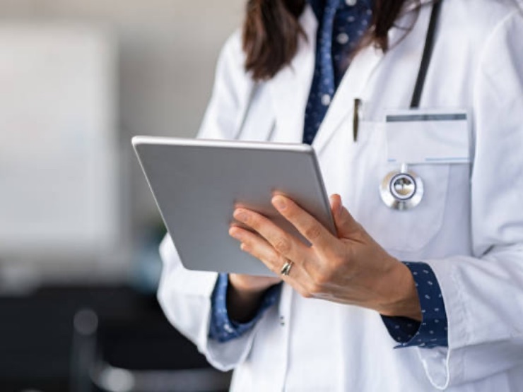 Female doctor working on tablet