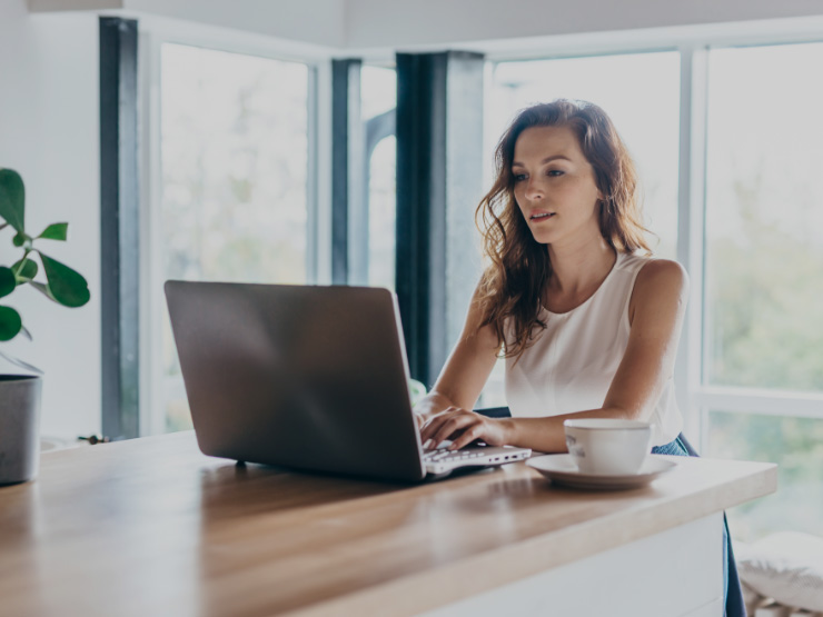 Woman working remotely on laptop